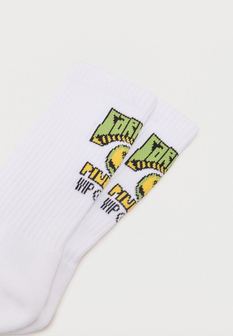 Pair of white ribbed socks with green, yellow, and black text and graphics near the top, featuring a circular design element.