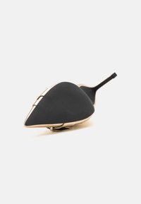 Black high-heeled shoe with a pointed toe and ridged texture, gold metal detailing on the upper, and a slender black stiletto heel.