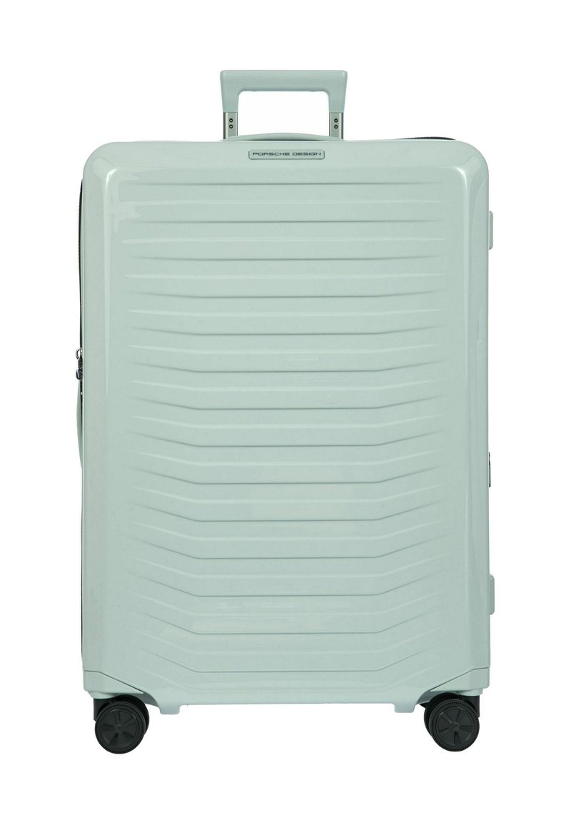 Hartschalentrolley in hellmintfarben mit horizontalen Rillen, ausziehbarem Griff und drehbaren Rollen für Mobilität. Sichtbarer Reißverschluss.