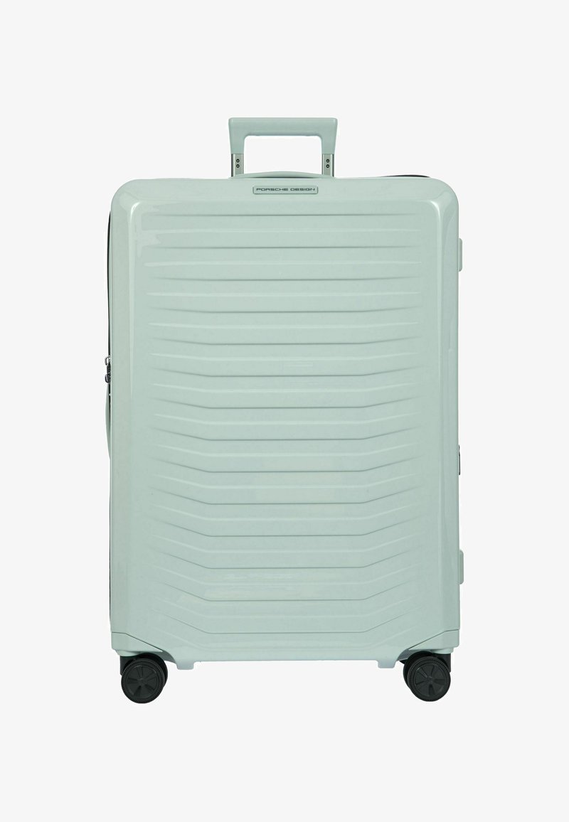 Hartschalentrolley in hellmintfarben mit horizontalen Rillen, ausziehbarem Griff und drehbaren Rollen für Mobilität. Sichtbarer Reißverschluss.