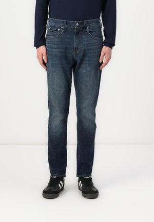 Dark Wash Athletic Skinny Jeans - Jeans Skinny Fit - dark blue denim