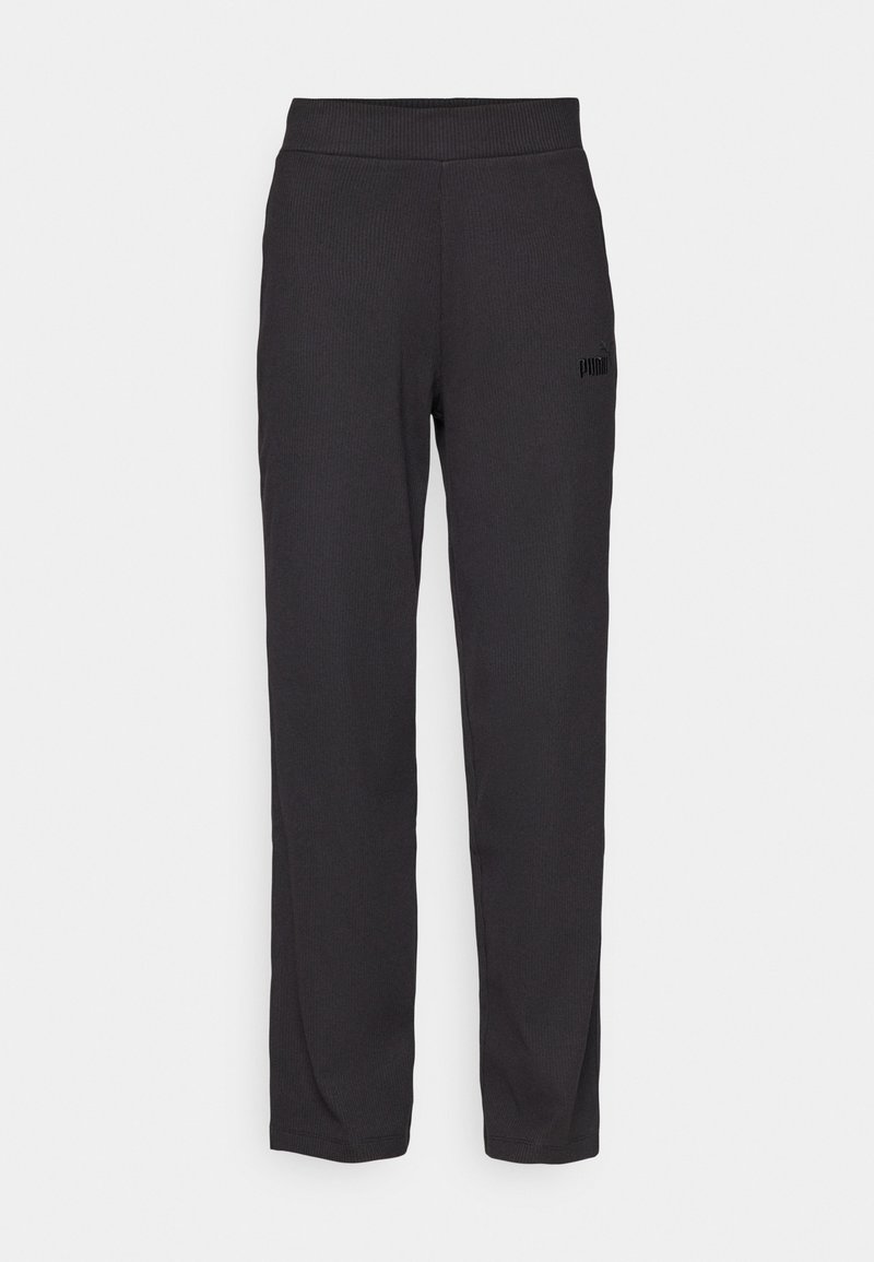 Pantaloni sportivi neri con una texture a coste, vita elastica e un piccolo logo nero accento vicino all'anca. Taglio dritto.
