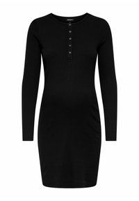 Robe noire à manches longues en tissu côtelé, avec un col rond et une patte de boutonnage à cinq boutons avec des accents métalliques.
