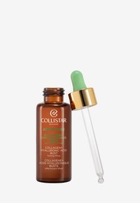 Collistar Attivi Puri-serum i en brun glasflaska med ett guldlock. Klar pipett med en grön spets. Texten på flaskan är på flera språk.