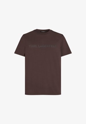 T-shirt en coton marron avec col rond et manches courtes. Logo "KARL LAGERFELD" dans une teinte légèrement plus foncée sur le devant.