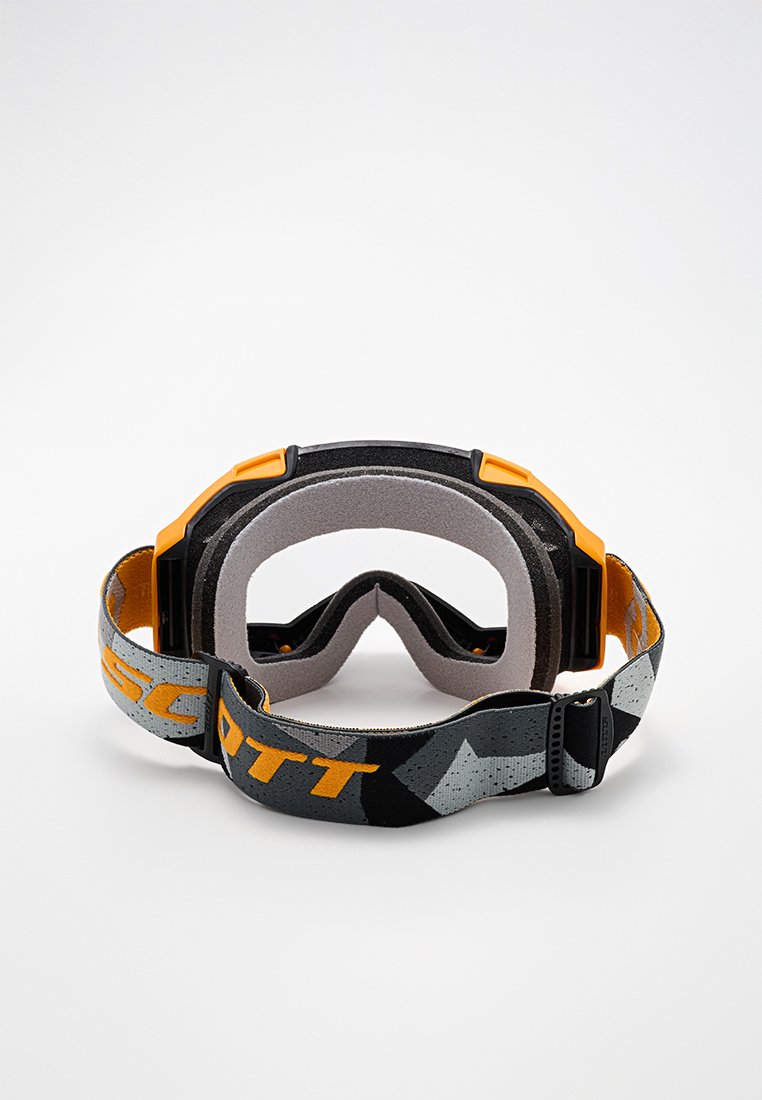 Gafas de ski Scott con una correa de patrón negro y gris con acentos en naranja, acolchado de espuma y un marco rectangular para mayor visibilidad.