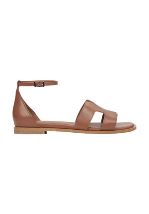 Brown leather flat sandals with a side ankle strap, open toe design, and two wide front straps, featuring a smooth texture and minimalistic style.