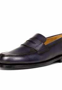 Navy blue leather loafer with a smooth finish, featuring a raised strap detail and stitching accents, set on a flat sole.