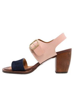 Open-toe sandal with navy suede front strap, pink leather ankle strap with gold buckle, and chunky wooden block heel.