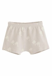Shorts en tissu côtelé beige clair avec taille élastique et motifs discrets de palmiers répartis uniformément sur le matériau.