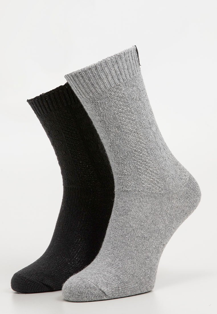 Black and gray socks displayed side by side. Ribbed cuffs, textured fabric with a diamond pattern on the gray sock and a smooth finish on the black.