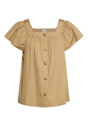 Blouse à manches courtes et décolleté carré en coton beige avec une coupe ample, comportant cinq boutons en bois sur le devant et des manches ballons plissées.