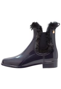 Black glossy ankle boots with faux fur trim and elastic side panels. Features a low heel and subtle metallic accent on the back.