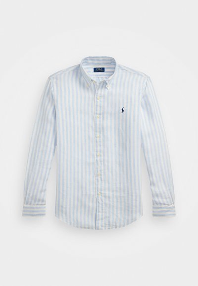 Svijetloplavi i bijeli prugasti dugosleeve majica, pamučni materijal, košulja s dugim rukavima i dugmetima, mali izvezeni logo na prsima, sadrži žute dugmadi.