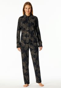 Black pajama set featuring a button-up shirt with gold floral patterns and matching pants. The fabric appears soft with a smooth texture.