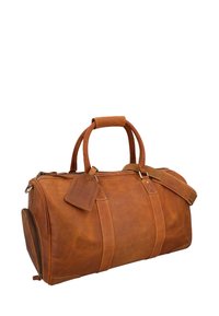 Brun læder duffelbag med dobbelte håndtag og justerbar skulderrem. Har lynlåslukning, sidelomme og bagagelabel. Glat tekstur.