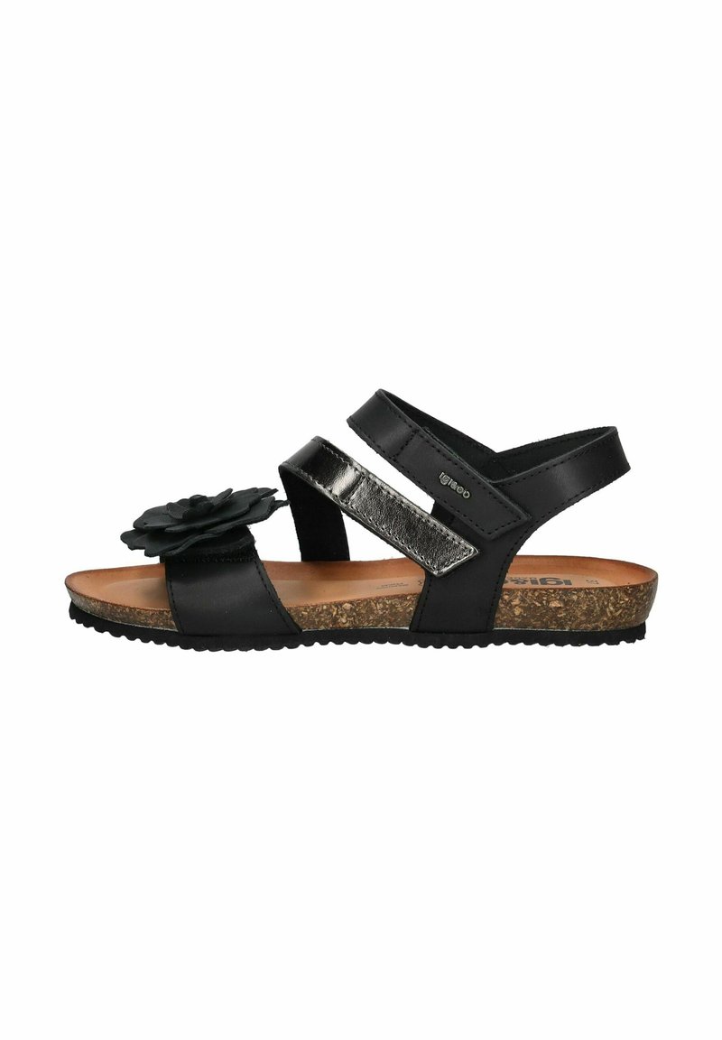 Black sandal with a flower accent, two adjustable straps, and a cork footbed. Features a smooth texture and rubber outsole for grip.
