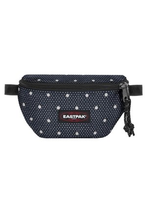 Banane Eastpak bleu marine à pois blancs, fermeture éclair noire avec cordons et patch logo au centre avant.