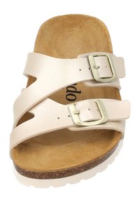 Sandal in un colore chiaro con due cinghie regolabili, fibbie dorate e una morbida soletta in sughero. Presenta una soletta beige testurizzata e una suola bianca.