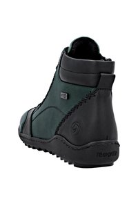 Stivale alla caviglia verde e nero in pelle liscia. Presenta una cerniera laterale, cuciture a contrasto e suola in gomma nera testurizzata.