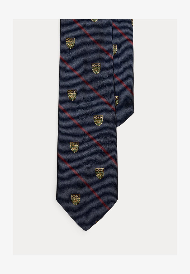 Cravate en soie bleu marine avec des rayures diagonales bordeaux et de petits motifs de blason jaune et vert.