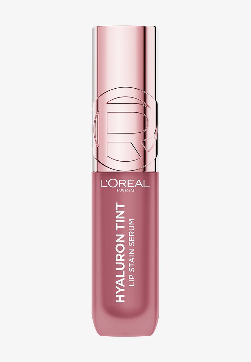 Hyaluron Tint Lip Stain Serum in een roze tube met een metallic zilveren dop. Voorzien van een geperst logo en witte tekst met productinformatie.