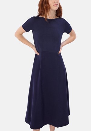 Navy blauwe jurk met korte mouwen, aansluitende bustier en een uitlopende rok tot knielengte. Gladde stof en een schoon, minimalistisch ontwerp.