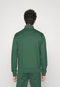 Ellesse BERLUSONI TRACK TOP - Træningsjakke - dark green