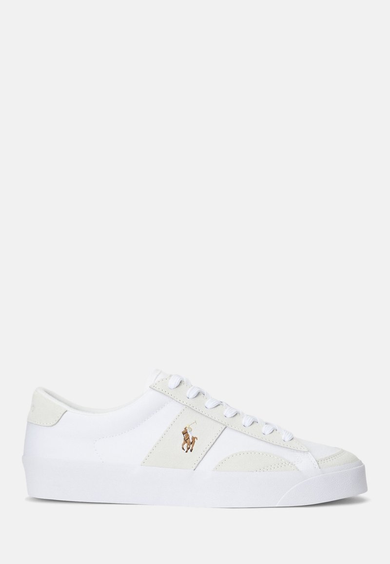 White low-top sneaker with white laces, beige suede accents, and brown polo player logo on the side, against a plain white background.