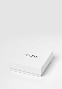 Weißer rechteckiger Kasten mit einem Deckel, geprägt mit "CHRIST est. 1865" in Schwarz. Glatte Textur mit einem sauberen, minimalistischen Design.