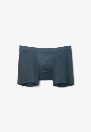 Boxers ajustados para hombre en azul oscuro, fabricados con un tejido suave y texturizado. Cuentan con una cinturilla lisa y un pouch frontal contorneado.