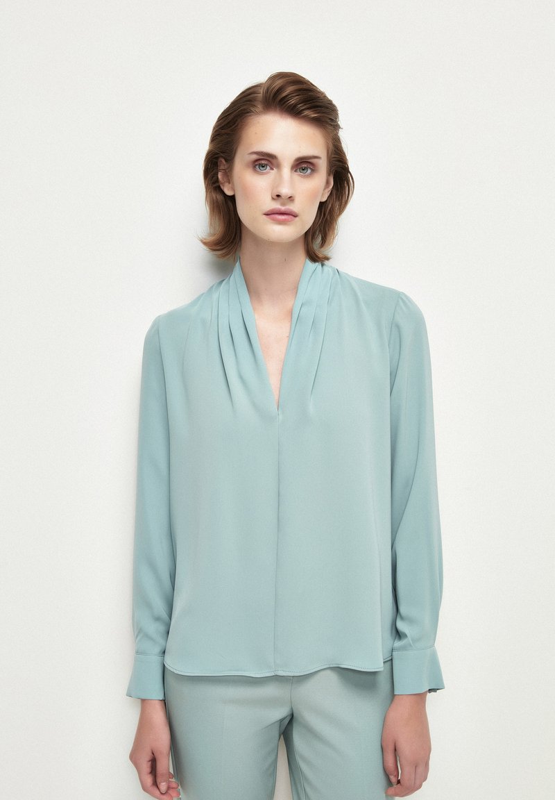 adL Blusa - mint/menta - Zalando.es