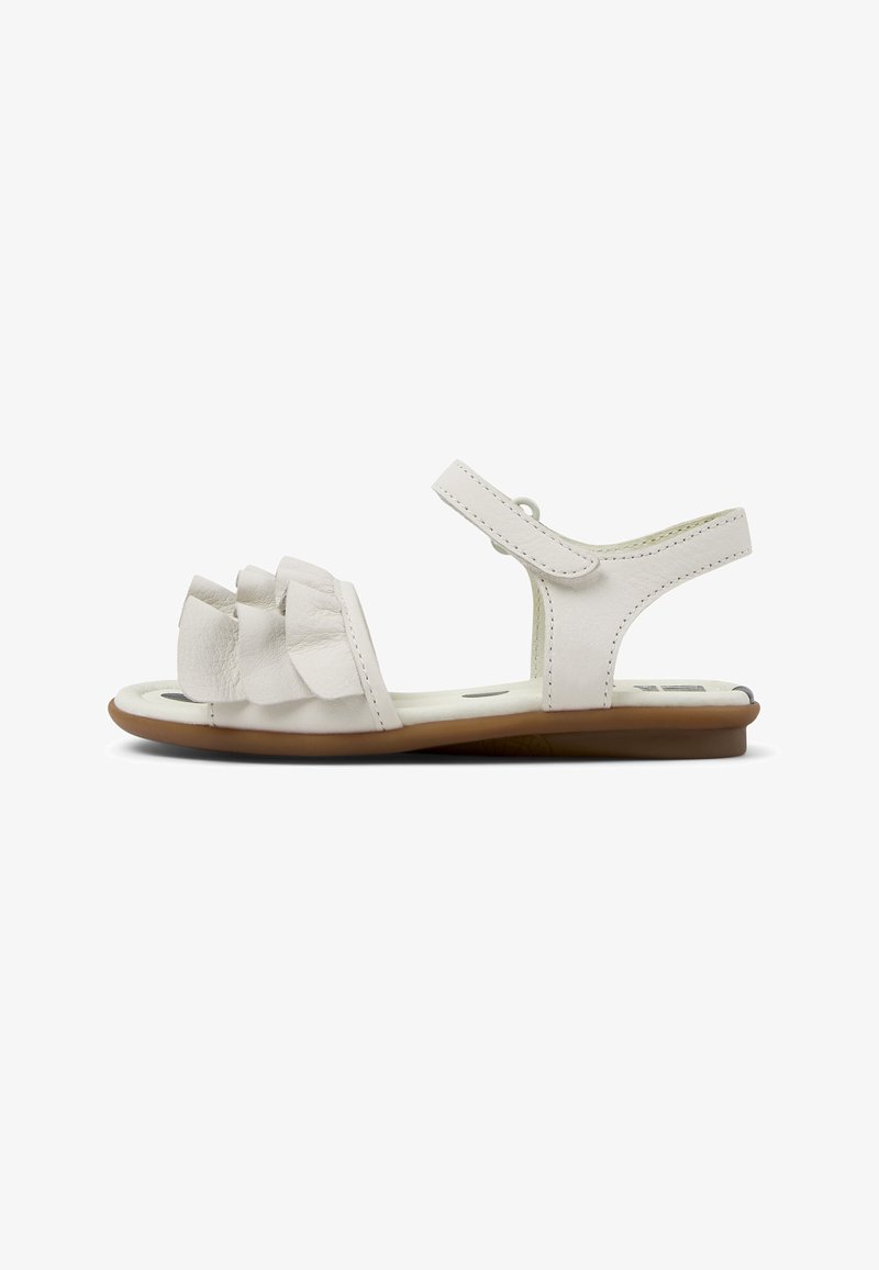 White leather sandal with three ruffled details on the toe, adjustable strap, and smooth flat sole in a light brown color.