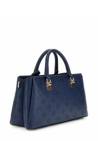 Borsa a mano blu in pelle con superficie testurizzata caratterizzata da motivi in rilievo. Ha due manici rotondi e dettagli in metallo argentato.