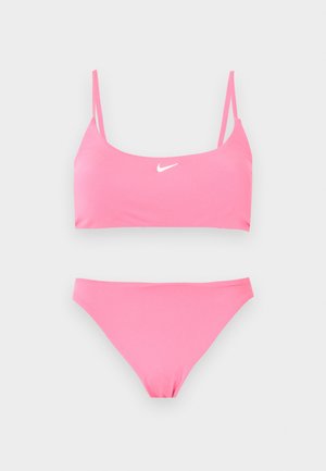 Two-piece pink Nike bikini with thin straps on the top and a white Nike swoosh logo centered on the top piece.