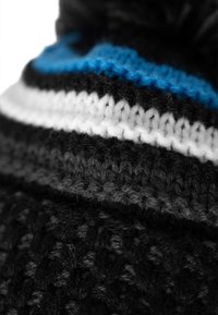 Black and gray knitted hat with blue and white stripes, featuring a textured pattern and a pom-pom at the top.