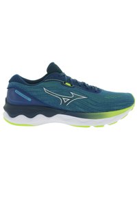 Zapatilla de correr azul y verde con parte superior de malla texturizada, suela media blanca y logo prominente en el lateral. Presenta un diseño acolchado.