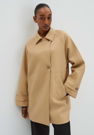 Beige faux leather coat with a collar, button closure, and two front pockets. Features wide sleeves and seam detailing.