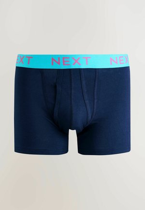 Marineblå boxershorts med en lys blå linning med pink "NEXT" brandingen. Fremstillet af et glat, elastisk stof med et tætsiddende design.