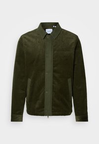 Olive green corduroy jacket with a button-up front, two side pockets, and a collar. Features vertical texture and a logo on the left chest.