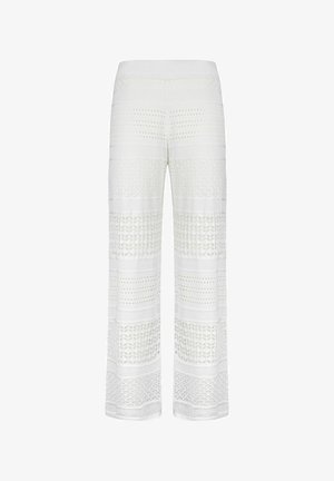 Vide ben bukser i hvid, med et tekstureret strikdesign med skiftende mønstre og gennemsigtige sektioner hele vejen igennem.