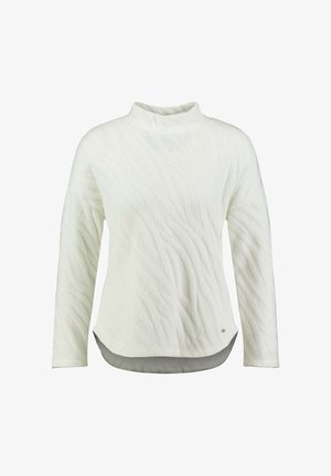 Pull texturé blanc à manches longues avec col montant et ourlet incurvé, présenté sur un fond blanc uni.