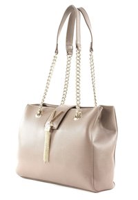 Taupe leather handbag with a soft texture, gold chain straps, and a decorative tassel accent. Features a structured shape and a snap closure.