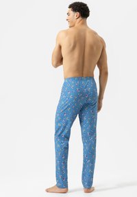 Blauwe pyjamabroek met een speels patroon van kleurrijke ijsconen. Elastische tailleband, lichtgewicht stof en een slim rechte snit.
