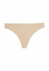 String in color beige con una texture liscia e elastica. Presenta un elastico con logo, un design a copertura minima e un motivo a coste sottile.