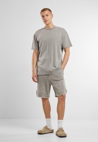 Urban Classics WASHED PIPED - Tepláky - steelgrey