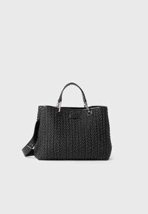 Black woven tote bag with dual top handles and a detachable shoulder strap. Features a textured finish and subtle branding on the front.