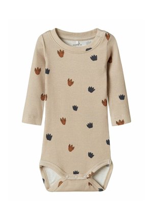 Beżowy, prążkowany bodysuit z długim rękawem, z rozproszonym wzorem kwiatowym w odcieniach brązu i granatu, z zapięciem na zatrzaski na dole, co ułatwia ubieranie.