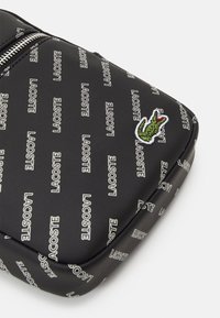 Lacoste SEASONAL UNISEX - Borsa a tracolla - noir farine