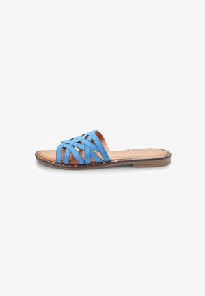 Blue leather slide sandal with woven strap design, flat sole, and brown textured insole. Exposed stitching adds subtle detailing.